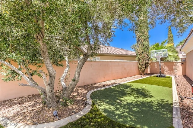 27 Via Paradiso St, Henderson, NV 89011 - fenced backyard with a putting area