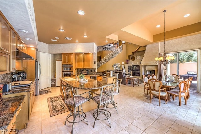 27 Via Paradiso St, Henderson, NV 89011 - dining area with a chandelier, recessed lighting, and light tile patterned flooring