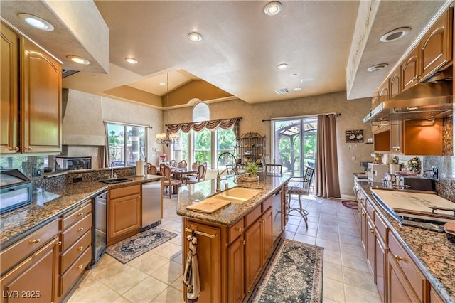 27 Via Paradiso St, Henderson, NV 89011 - kitchen with a sink, wine cooler, light tile patterned flooring, brown cabinets, and recessed lighting