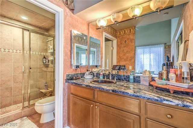 27 Via Paradiso St, Henderson, NV 89011 - bathroom with toilet, a stall shower, vanity, and tile patterned flooring