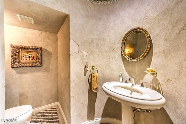 27 Via Paradiso St, Henderson, NV 89011 - half bath featuring toilet and baseboards