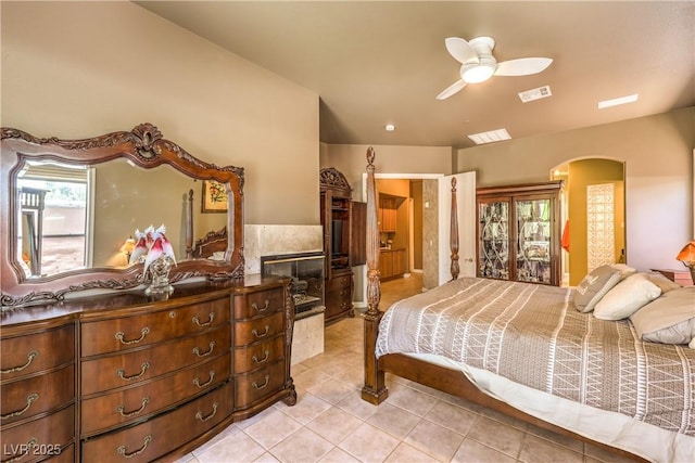 27 Via Paradiso St, Henderson, NV 89011 - bedroom with arched walkways, light tile patterned floors, and a ceiling fan