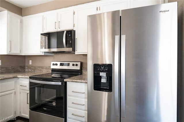 6873 Tamarus St Unit 201, Las Vegas, NV 89119 - kitchen featuring stainless steel appliances and white cabinets