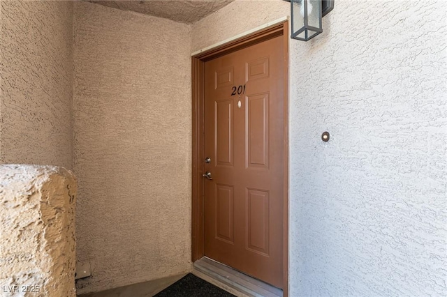 6873 Tamarus St Unit 201, Las Vegas, NV 89119 - view of exterior entry with stucco siding