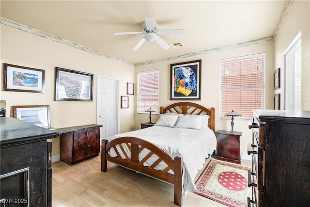 5456 Raccoon Valley Ln, Las Vegas, NV 89122 - bedroom featuring light wood-style floors, a ceiling fan, ornamental molding, and baseboards