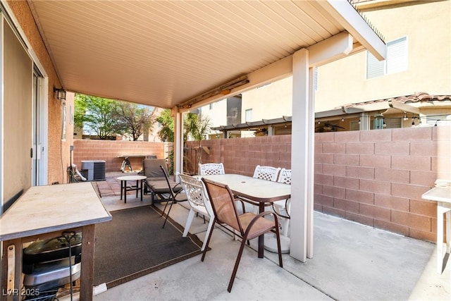 5456 Raccoon Valley Ln, Las Vegas, NV 89122 - fenced backyard featuring outdoor dining area, a patio area, and cooling unit