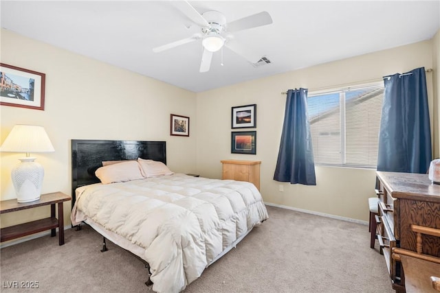 5456 Raccoon Valley Ln, Las Vegas, NV 89122 - bedroom with light carpet, baseboards, and a ceiling fan