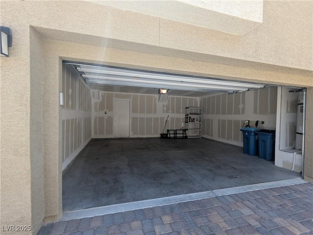 2629 Mocha Pearl Ct, North Las Vegas, NV 89086 - garage with water heater, a garage door opener, and driveway