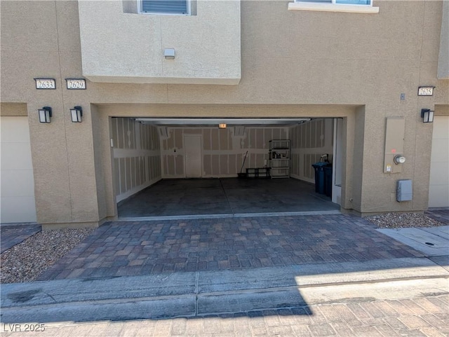 2629 Mocha Pearl Ct, North Las Vegas, NV 89086 - garage featuring decorative driveway