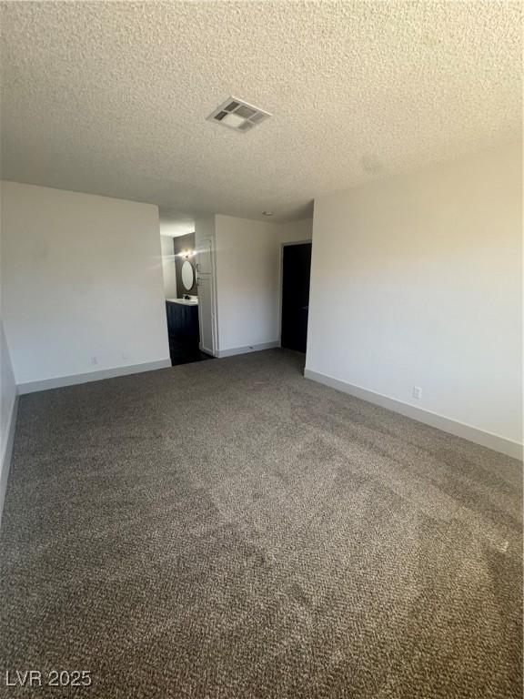 3920 Aspencrest Dr, Las Vegas, NV 89108 - carpeted spare room with a textured ceiling and baseboards