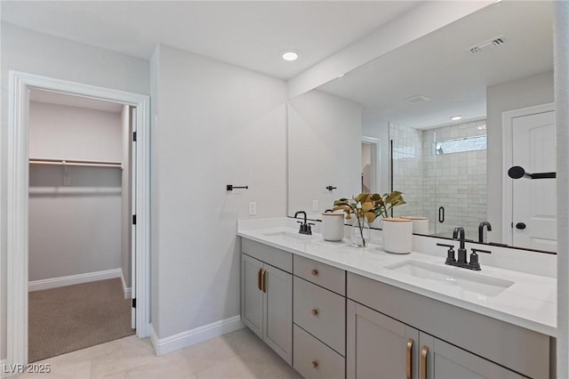7983 Texas Hills St, Las Vegas, NV 89113 - full bath featuring double vanity, a shower stall, a spacious closet, baseboards, and recessed lighting