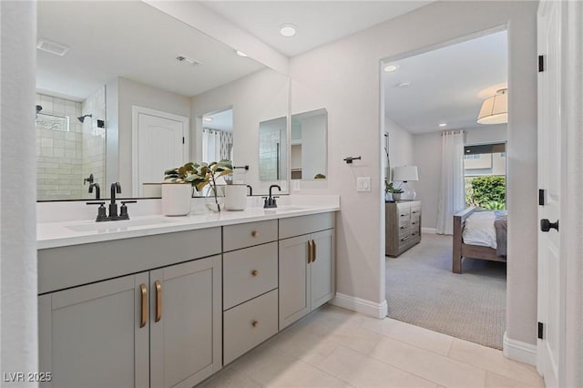 7983 Texas Hills St, Las Vegas, NV 89113 - full bath with double vanity, connected bathroom, baseboards, a tile shower, and recessed lighting