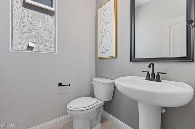 7983 Texas Hills St, Las Vegas, NV 89113 - bathroom with baseboards and toilet