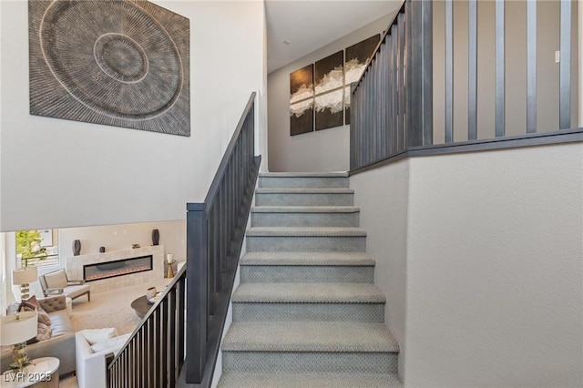 7983 Texas Hills St, Las Vegas, NV 89113 - stairway with a glass covered fireplace