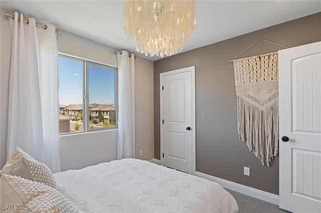 7983 Texas Hills St, Las Vegas, NV 89113 - carpeted bedroom with a chandelier and baseboards