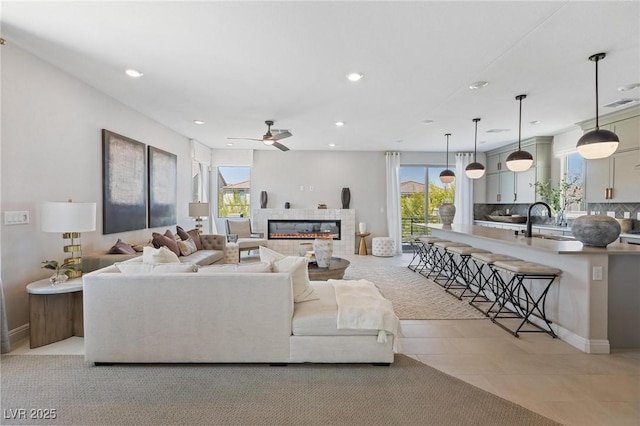 7983 Texas Hills St, Las Vegas, NV 89113 - living area featuring recessed lighting, ceiling fan, and a tile fireplace