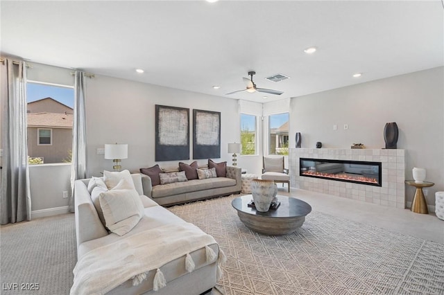 7983 Texas Hills St, Las Vegas, NV 89113 - carpeted living room featuring a tile fireplace, recessed lighting, a ceiling fan, and baseboards