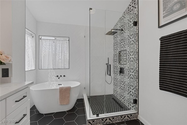 9428 Sierra Summit Ave, Las Vegas, NV 89134 - bathroom with tile patterned flooring, a stall shower, a soaking tub, and vanity