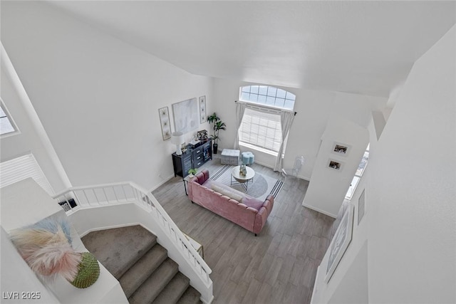 9428 Sierra Summit Ave, Las Vegas, NV 89134 - living area featuring lofted ceiling, wood finished floors, and baseboards