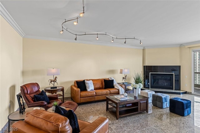 2777 Paradise Rd Unit 2302, Las Vegas, NV 89109 - living room featuring crown molding, granite floors, a tiled fireplace, and track lighting