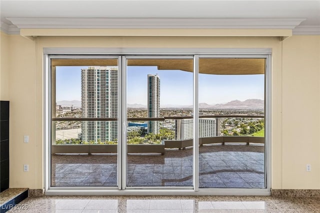 2777 Paradise Rd Unit 2302, Las Vegas, NV 89109 - doorway featuring ornamental molding, plenty of natural light, a mountain view, and a city view