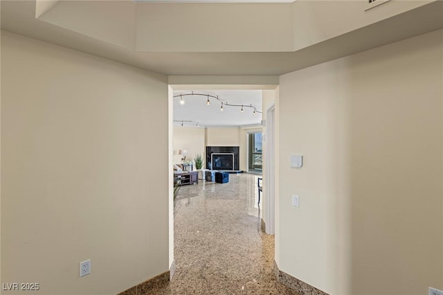 2777 Paradise Rd Unit 2302, Las Vegas, NV 89109 - hall featuring baseboards and rail lighting