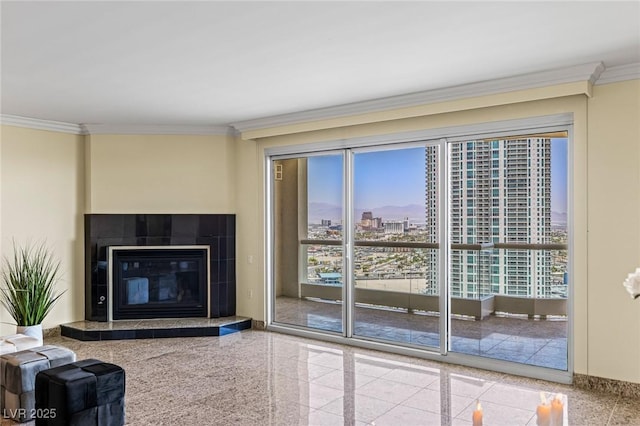 2777 Paradise Rd Unit 2302, Las Vegas, NV 89109 - living area with crown molding, granite tiled floors, plenty of natural light, a view of city, and a tile fireplace
