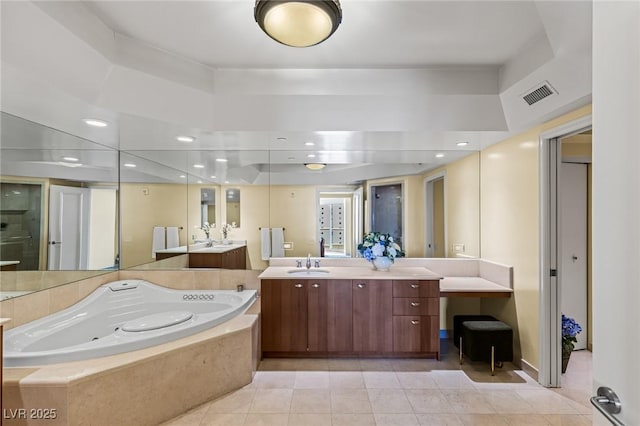 2777 Paradise Rd Unit 2302, Las Vegas, NV 89109 - bathroom featuring a jetted tub, tile patterned floors, and vanity