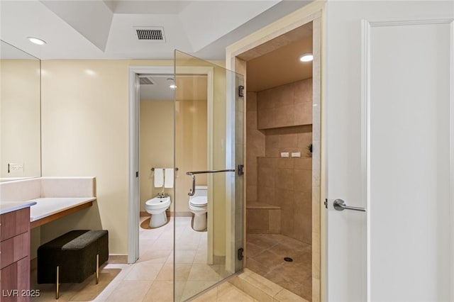 2777 Paradise Rd Unit 2302, Las Vegas, NV 89109 - full bathroom with a bidet, vanity, a shower stall, tile patterned flooring, and recessed lighting