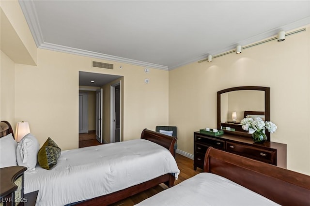 2777 Paradise Rd Unit 2302, Las Vegas, NV 89109 - bedroom with crown molding and wood finished floors