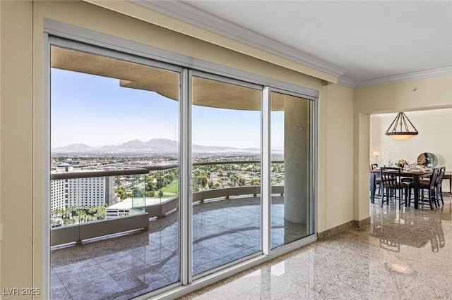 2777 Paradise Rd Unit 2302, Las Vegas, NV 89109 - doorway with a mountain view, crown molding, and granite tiled floors