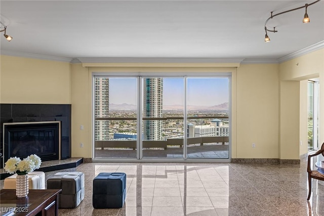 2777 Paradise Rd Unit 2302, Las Vegas, NV 89109 - living area featuring ornamental molding, track lighting, and a fireplace