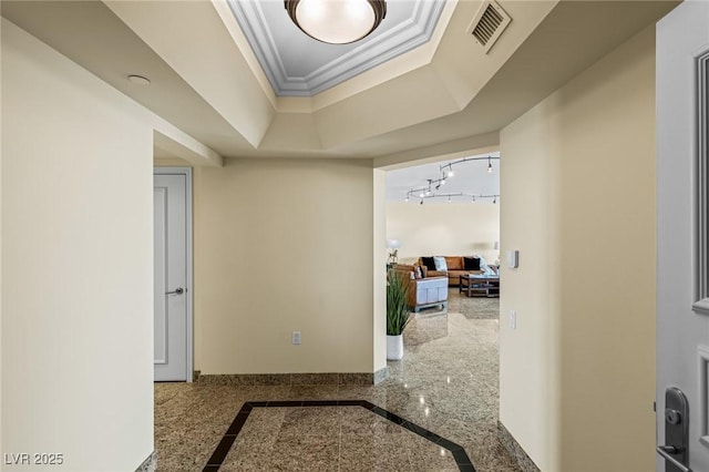 2777 Paradise Rd Unit 2302, Las Vegas, NV 89109 - hallway with inlaid floor details, ornamental molding, granite tiled floors, and a tray ceiling