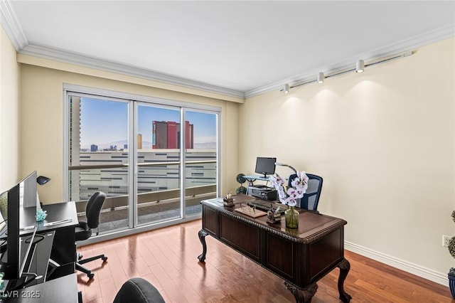 2777 Paradise Rd Unit 2302, Las Vegas, NV 89109 - home office with crown molding, wood finished floors, and track lighting