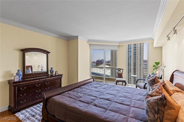 2777 Paradise Rd Unit 2302, Las Vegas, NV 89109 - bedroom with ornamental molding and wood finished floors
