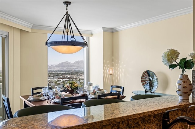 2777 Paradise Rd Unit 2302, Las Vegas, NV 89109 - dining room featuring ornamental molding and a mountain view