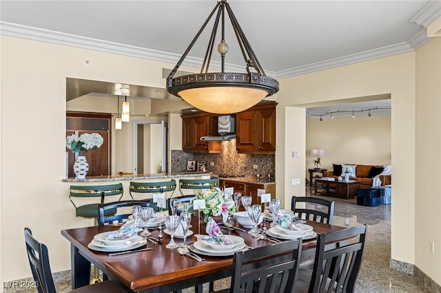 2777 Paradise Rd Unit 2302, Las Vegas, NV 89109 - dining area featuring crown molding and rail lighting