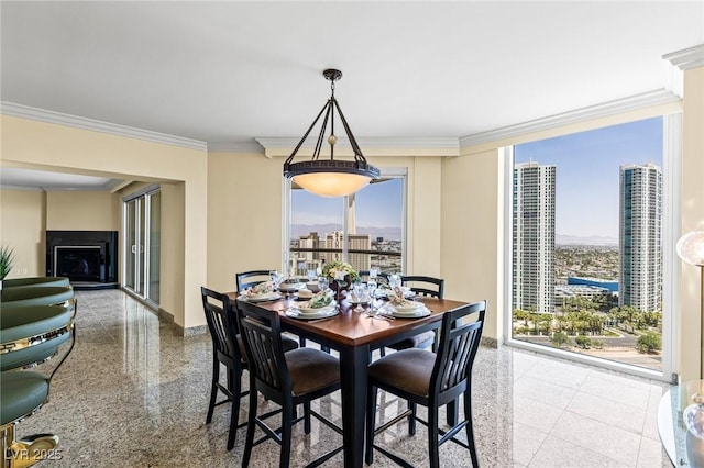 2777 Paradise Rd Unit 2302, Las Vegas, NV 89109 - dining room with ornamental molding, a view of city, granite tiled floors, and a fireplace