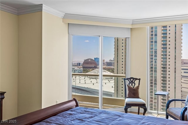 2777 Paradise Rd Unit 2302, Las Vegas, NV 89109 - bedroom featuring crown molding, multiple windows, and a view of city