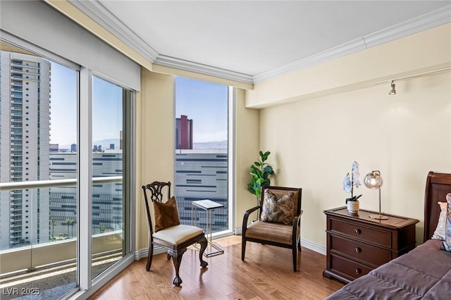 2777 Paradise Rd Unit 2302, Las Vegas, NV 89109 - bedroom with crown molding, wood finished floors, and a city view