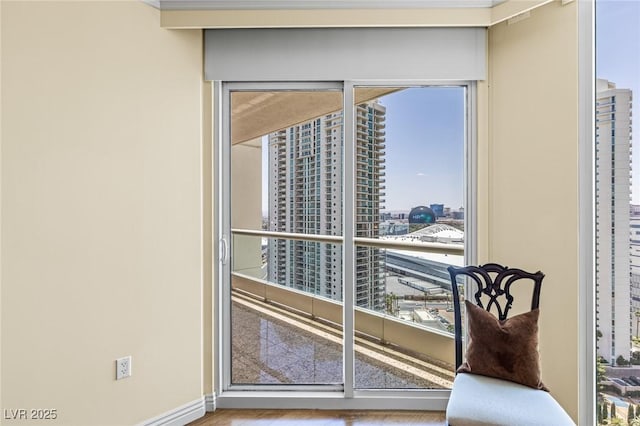2777 Paradise Rd Unit 2302, Las Vegas, NV 89109 - doorway with a view of city and wood finished floors