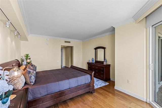 2777 Paradise Rd Unit 2302, Las Vegas, NV 89109 - bedroom featuring light wood-style flooring and crown molding