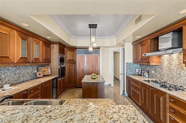 2777 Paradise Rd Unit 2302, Las Vegas, NV 89109 - kitchen with built in appliances, granite floors, light stone counters, decorative backsplash, and crown molding
