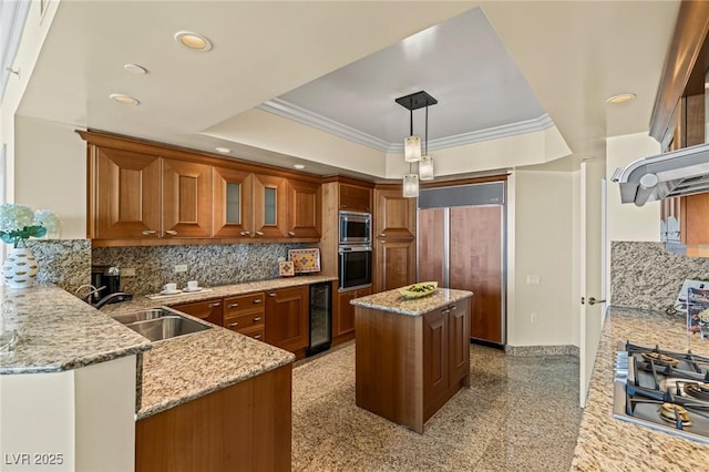 2777 Paradise Rd Unit 2302, Las Vegas, NV 89109 - kitchen featuring beverage cooler, built in appliances, brown cabinets, light stone countertops, and recessed lighting
