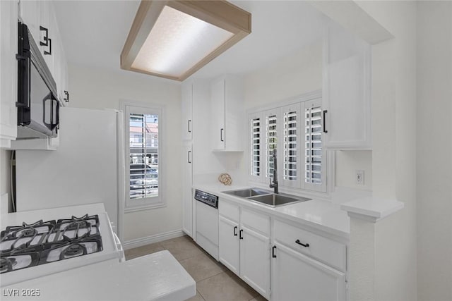 4843 S Torrey Pines Dr Unit 101, Las Vegas, NV 89103 - kitchen with dishwasher, a sink, white cabinetry, and light countertops