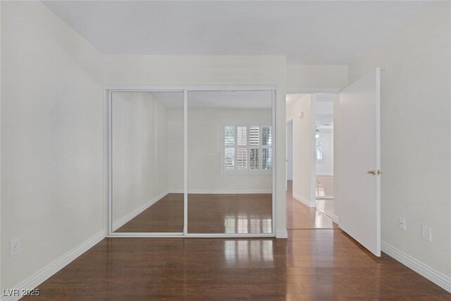 4843 S Torrey Pines Dr Unit 101, Las Vegas, NV 89103 - unfurnished bedroom with wood finished floors, baseboards, and a closet