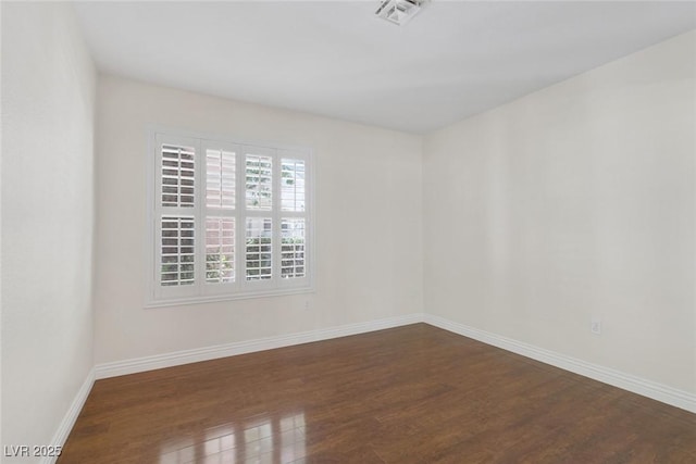 4843 S Torrey Pines Dr Unit 101, Las Vegas, NV 89103 - unfurnished room with dark wood-style flooring and baseboards