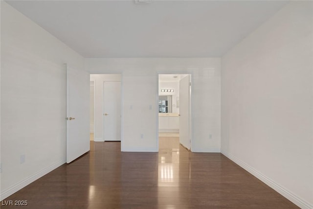 4843 S Torrey Pines Dr Unit 101, Las Vegas, NV 89103 - empty room featuring wood finished floors and baseboards