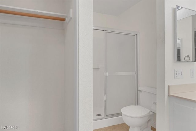 4843 S Torrey Pines Dr Unit 101, Las Vegas, NV 89103 - full bath featuring vanity, a stall shower, toilet, and tile patterned flooring