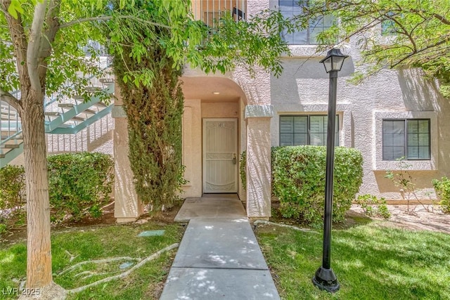 4843 S Torrey Pines Dr Unit 101, Las Vegas, NV 89103 - property entrance featuring stucco siding and a lawn